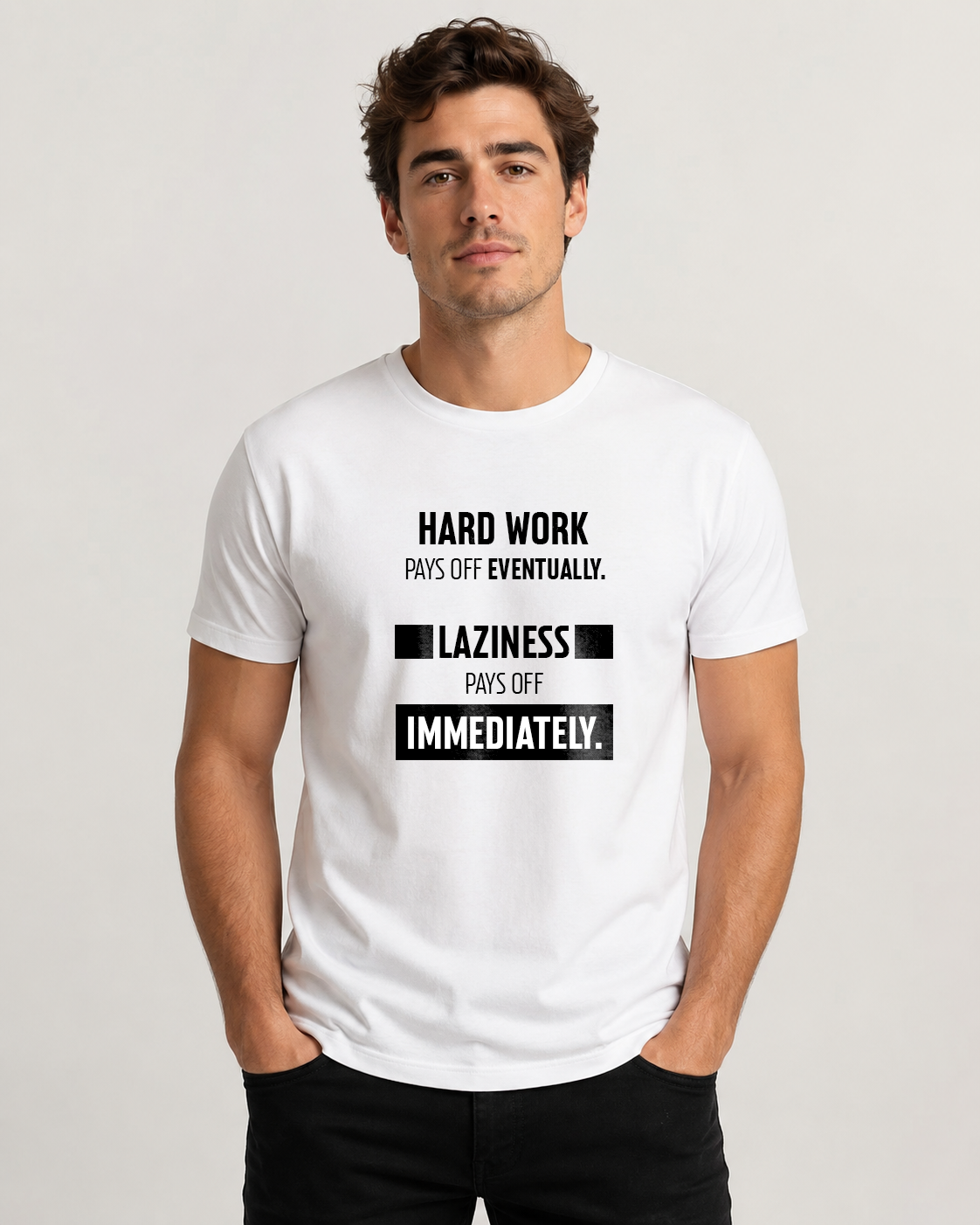 White men's t-shirt with quote "Hard work pays off eventually. Laziness…" – Underperform, size XS